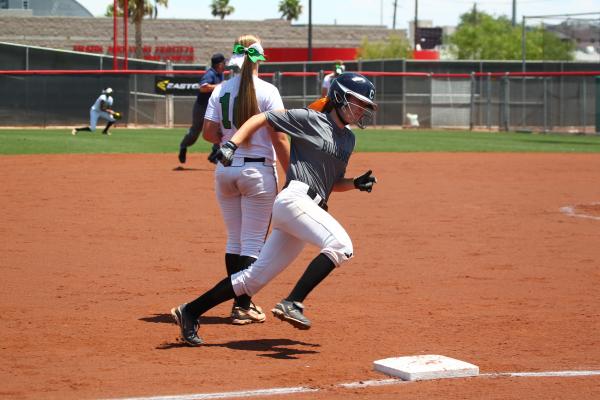 Centennial’s Alyssa Finger prepares to round third base and score the Bulldogs’ ...