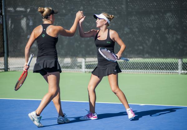 Palo Verde’s Chloe Henderson, left, and Sophie Henderson celebrate in the girls double ...