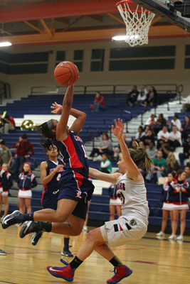 Liberty’s Sydney Clark jumps for a shot as she is fouled by Coronado’s Skyler Fe ...