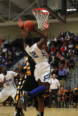 Desert Pines’ Donavin Wright shoots over Clark’s Malcolm Davis during the Divisi ...