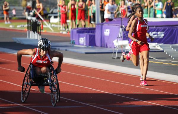 Wheelchair athlete Cheyenne Leonard heads toward the finish line while winning the 1,600 met ...