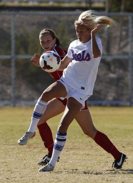 Kaila Brinkman, right, of Bishop Gorman and Jamie Wilson of Arbor View battle for the ball d ...