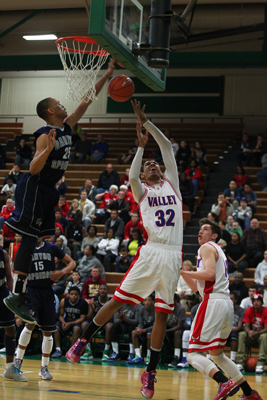 Canyon Springs’ Gerad Davis, left, jumps to block a shot from Valley’s Daniel Yo ...