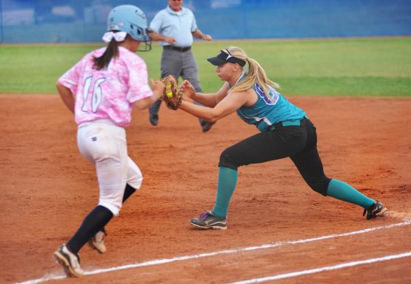 Silverado’s Kaitlynn Crane records an out at first base against Foothill runner Jordan ...