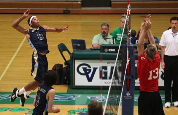 Foothill’s Cory Fisher, left, jumps before hitting the ball as Las Vegas tries to defe ...