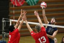 Foothill’s Blake Bootsma jumps to hit against Las Vegas’ Guillermo Gonzalez (7) ...