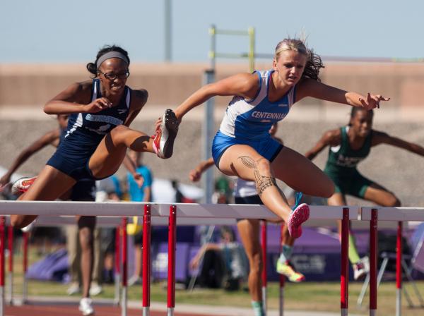 Centennial’s Tiana Bonds, right, wins the girls 100-meter hurdles on Friday during the ...