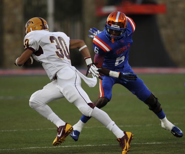 Mountain Pointe’s Paul Lucas (30) runs by Bishop Gorman’s Terrance Chambers on h ...