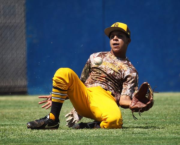 Bonanza center fielder Daniel Romero slides to make a catch during the fifth inning on Frida ...