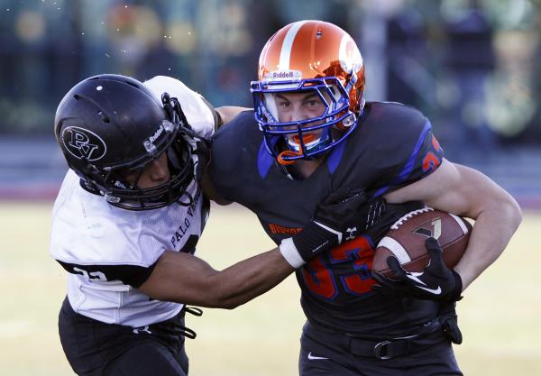 Palo Verde’s Calvin Beaulieu, left, tries to bring down Bishop Gorman’s Johnatha ...