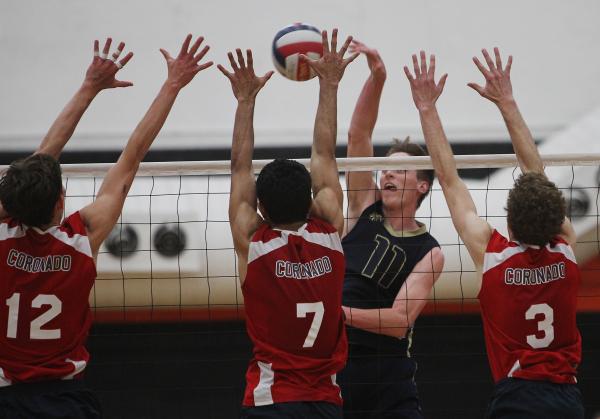 Coronado players, from left, Tyler Cucullu, Timothy McMoore-Tuamoheloa and Matt Pettit try t ...