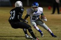 Green Valley’s Markus Varner looks to get past Canyon Springs’ Christian Minor o ...