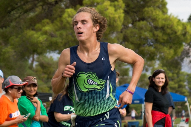 Austin Rogers, of Green Valley High School, runs toward the finish line during the Cross Cou ...