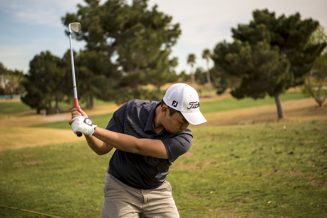 Desert Oasis golf team member Syouta Wakisaka swings during practice at Palm Valley Golf Cou ...