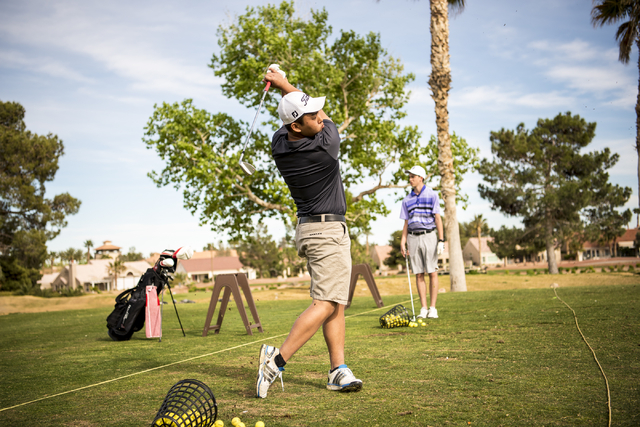 Desert Oasis golf team member Syouta Wakisaka swings during practice at Palm Valley Golf Cou ...