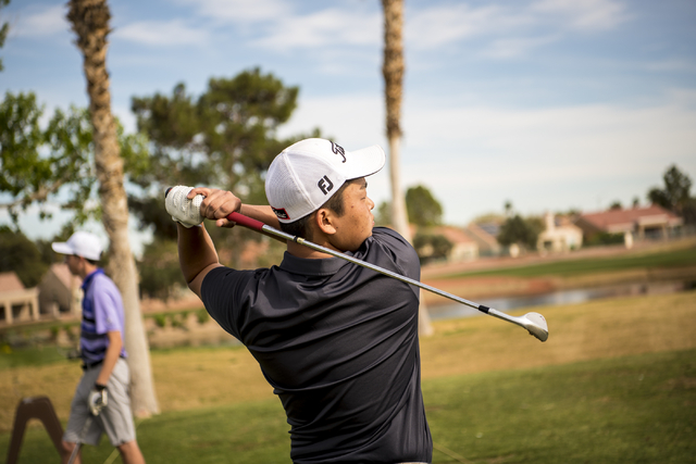 Desert Oasis golf team member Syouta Wakisaka swings during practice at Palm Valley Golf Cou ...