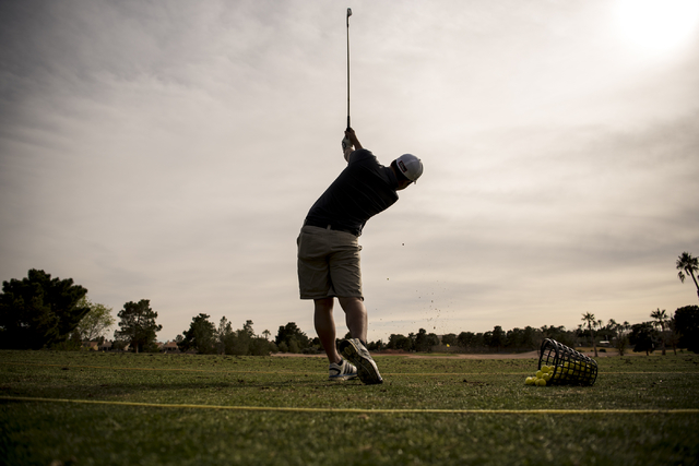 Desert Oasis golf team member Syouta Wakisaka swings during practice at Palm Valley Golf Cou ...