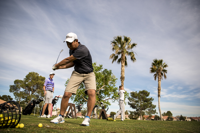 Desert Oasis golf team member Syouta Wakisaka swings during practice at Palm Valley Golf Cou ...