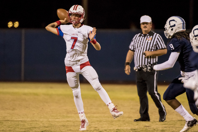 Liberty Patriots quarterback Kenyon Oblad (7) throws the ball against the Centennial Bulldog ...