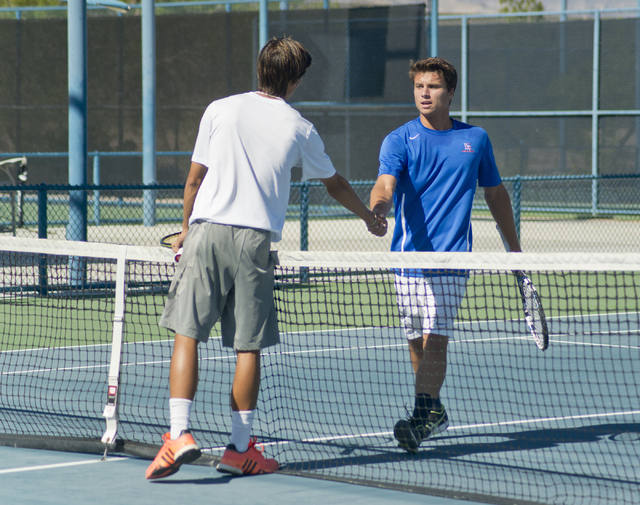 Sam Sholeff, right, and Dylan Levitt shake hands after their match during the Nevada state c ...