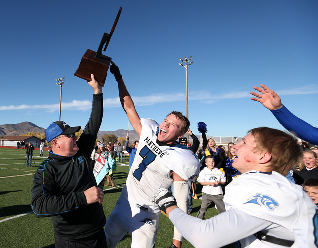 Pahranagat Valley Head Coach Ken Higbee and Shawn Wadsworth celebrate after defeating Whitte ...