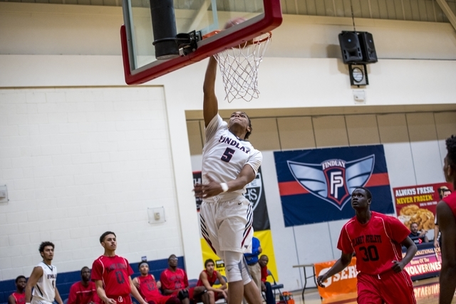 P.J. Washington of Findlay Prep dunks the ball against Planet Athlete Academy at Henderson I ...