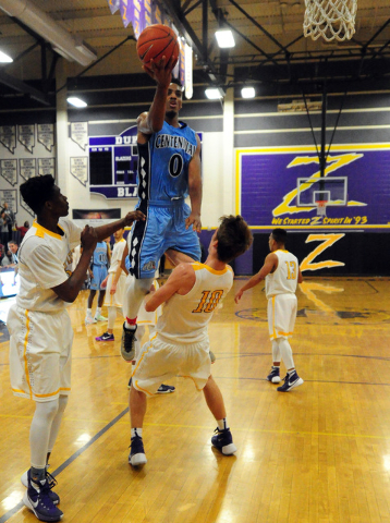 Centennial guard Troy Brown (0) is fouled by Durango forward Jason Landman (10) in the fourt ...