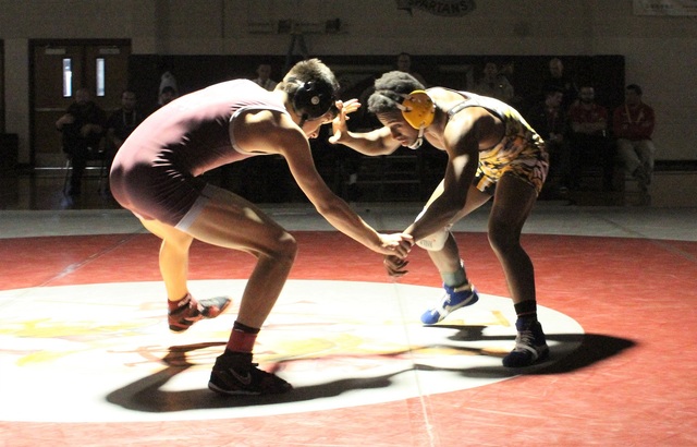 Cimarron-Memorial’s Nathaniel Rodriguez, left, ties up with Clark’s Melekte Demd ...