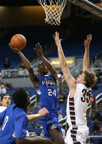 Desert Pines’ Nate Grimes, seen shooting over Elko defender Brian Pearson during a Div ...