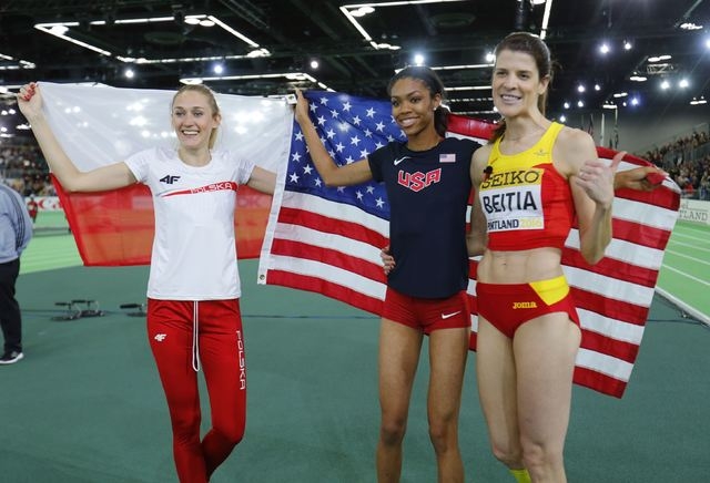 Bronze medal winner Kamila Licwinko of Poland, gold medal winner Vashti Cunningham of the U. ...