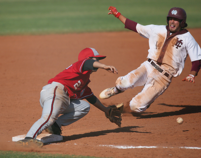 Arbor View’s Quinn Gallagher, left, goes for a catch as Cimarron-Memorial’s Niko ...