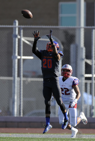 Bishop Gorman cornerback Jabari Butler (20) intercepts a pass intended for Liberty wide rece ...