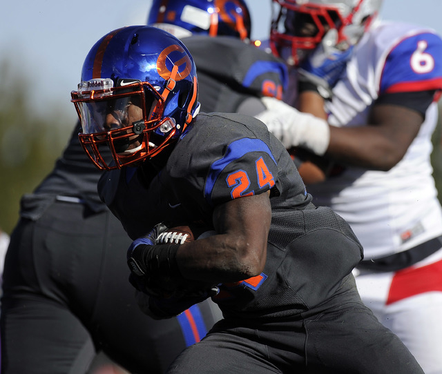 Bishop Gorman halfback Russell Booze (24) rushes against Liberty in the first half of their ...