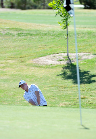 Shadow Ridge’s Benjamin Davis shoots for the green on the fifth hole during the final ...