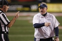 UNR coach Brian Polian speaks with an official during the second half of an NCAA college foo ...