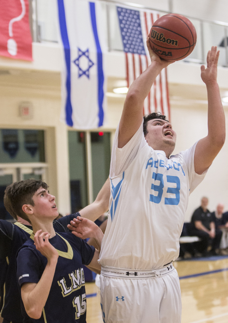 Adelson School’s Brandon Pappas (33) shoots a baseline jump shot over Lake Mead’ ...