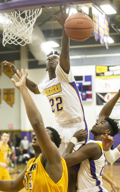 Durango’s Vernell Watts (22) blocks the shot of Clark’s Antwon Jackson (23) duri ...