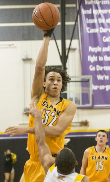 Clark’s Ian Alexander (32) makes a no look pass over Durango’s Demetrius Valdez ...