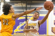 Durango’s Nicquel Blake (23) slices to the rim past Clark’s Ian Alexander (32) ...