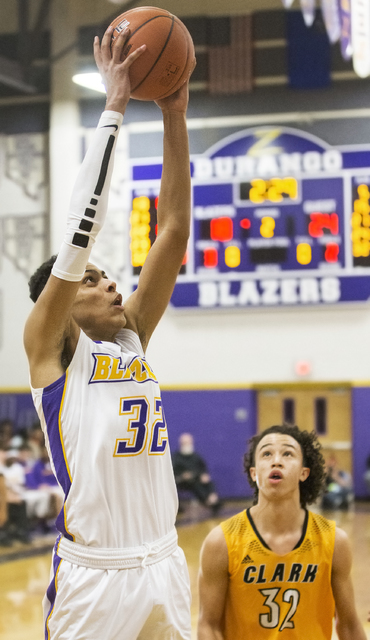 Durango’s Jeremie Portuondo (32) elevates for a dunk over Clark’s Ian Alexander ...