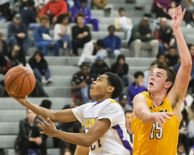 Durango’s Anthony Hunter (21) slices to the rim past Clark’s James Bridges (15) ...