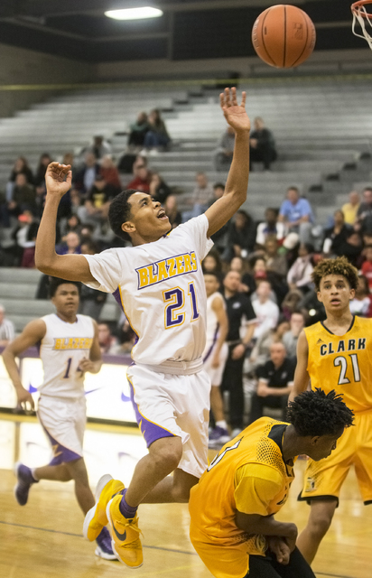 Durango’s Anthony Hunter (21) elevates for a rebound over Clark’s Jalen Hill (21 ...