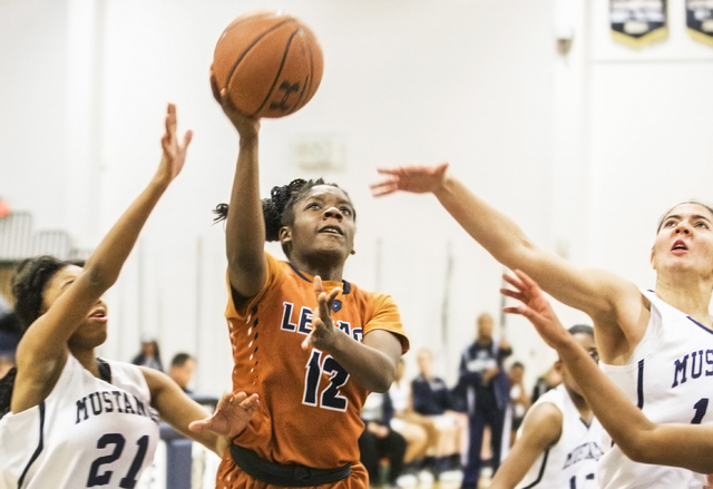 Legacy’s Damijah Yarbrough (12) drives past Shadow Ridge’s Mi’Theajah Alex ...