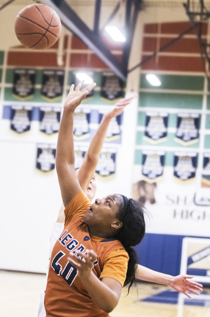 Legacy’s Skyler Bradley (40) drives baseline past Shadow Ridge’s Alexa Martins ...