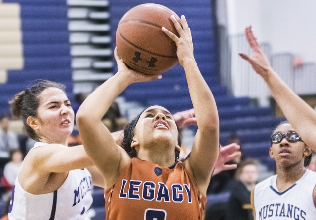 Legacy’s Taeha Pankey (3) drives past Shadow Ridge’s Alexa Martins (12) during t ...