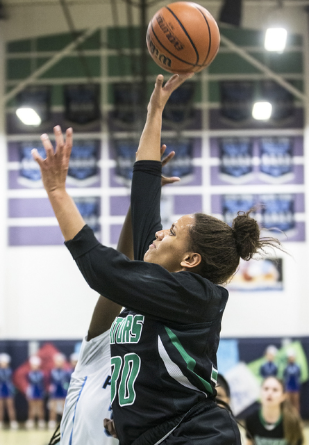 Green Valley’s Samara Miller (30) drives baseline past a Canyon Springs defender durin ...