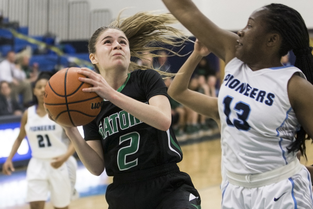 Green Valley’s Temerity Bauer (2) drives past Canyon Springs’ Ke’Ajanae Ha ...