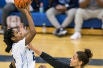 Canyon Springs’ Dayonna Maddox (24) shoots a jump shot over Green Valley’s Samar ...