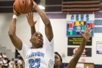 Canyon Springs’ Elbert Bibbs (23) drives to the basket on Monday, Nov. 28, 2016, at Ca ...