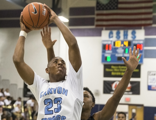 Canyon Springs’ Elbert Bibbs (23) drives to the basket on Monday, Nov. 28, 2016, at Ca ...